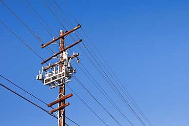 Power line against blue sky