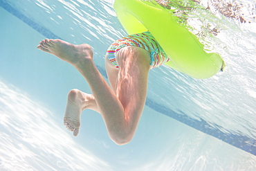 Girl (10-11) swimming underwater