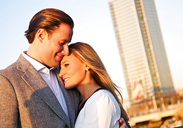 USA, New York, Long Island City, Young couple embracing outdoors