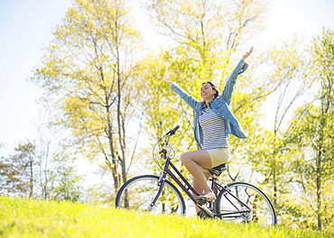 Mid adult woman riding bicycle, Central Park, New York City