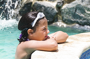 View of girl (8-9 years) wearing swimming goggle, Humacao, Puerto Rico