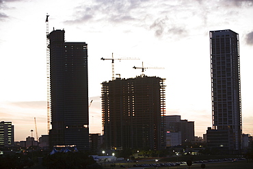 Urban construction scene at sunset