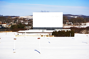 Blank billboard in snowy rural area