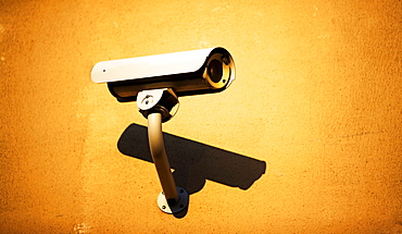 Surveillance camera on wall