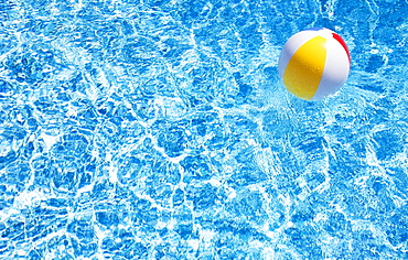 Beach ball in swimming pool