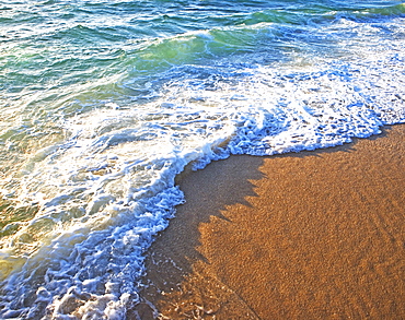 High angle view of ocean waves on shore