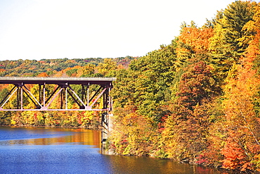 Bridge among autumn foliage, New York