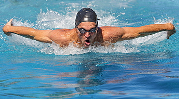 Athletic man swimming