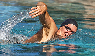 Athletic man swimming