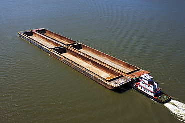 Boat and barges in river