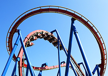 Rollercoaster against blue sky