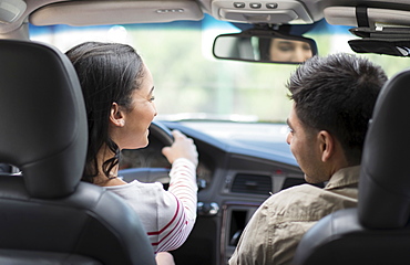 Young couple traveling in car