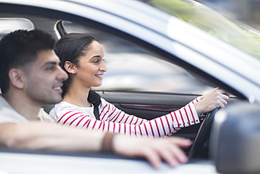 Young couple traveling in car