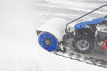 USA, New York City, machine removing snow