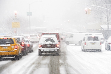 USA, New York City, city traffic in snowstorm