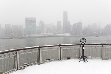 USA, New York City, coin operated binoculars overlooking foggy Manhattan