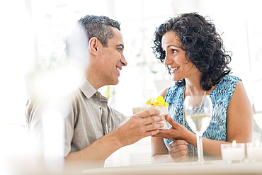 Couple celebrating anniversary in restaurant