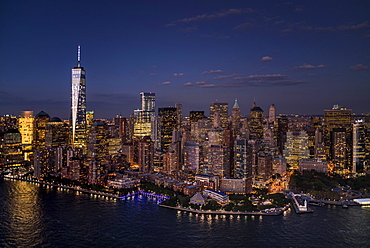 Aerial view of city with Freedom tower at night, New York City, New York