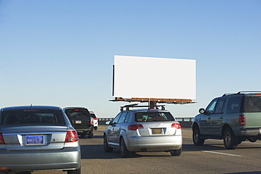 Traffic and blank billboard