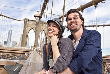 Happy couple on Brooklyn Bridge, Brooklyn, New York