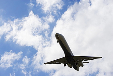 Low angle view of flying airplane