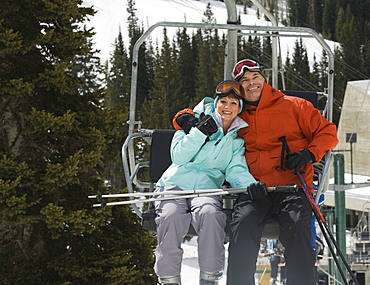 Couple on ski lift