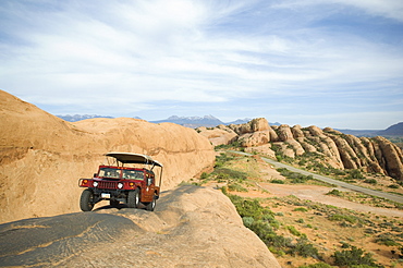 Off-road vehicle driving on rock formation