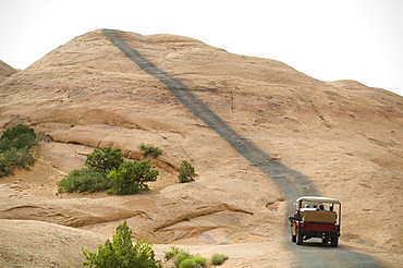 Off-road vehicle driving on rock formation