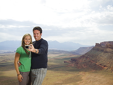 Couple taking own photograph