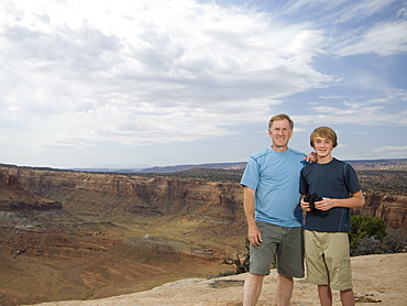 Father and son in front of canyon
