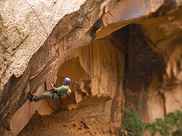 Man canyon rappelling