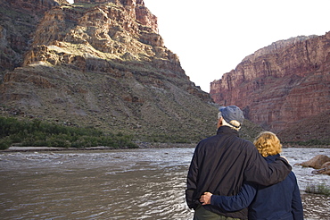 Couple looking at river, Colorado River, Moab, Utah, United States