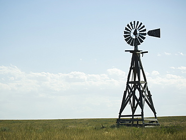 Windmill in field