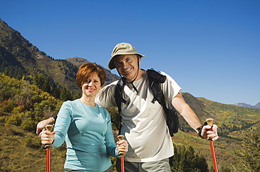 Senior couple holding hiking poles, Utah, United States