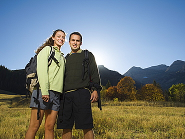 Couple wearing backpacks outdoors, Utah, United States