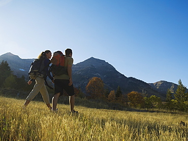 Couple hiking with backpacks, Utah, United States