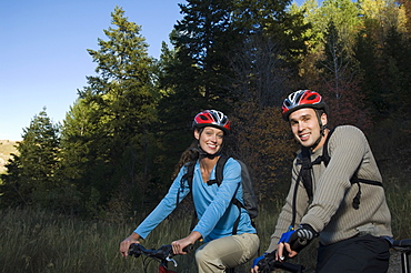 Couple on mountain bikes, Utah, United States