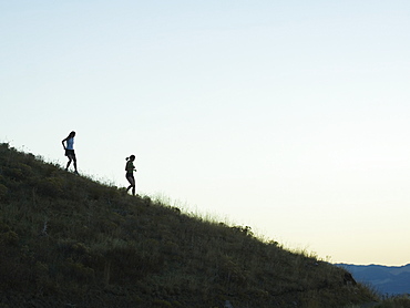 People walking down mountain, Salt Flats, Utah, United States