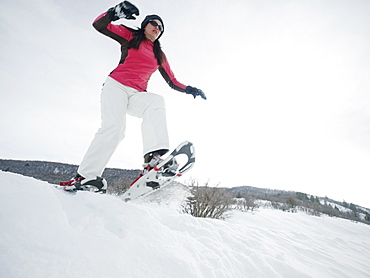 Woman snow shoeing