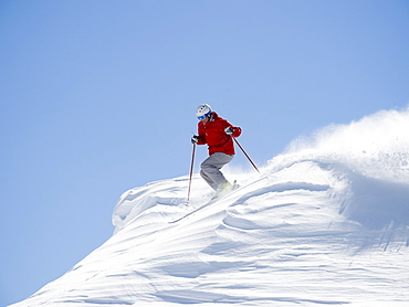 Man skiing downhill