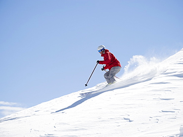 Man skiing downhill