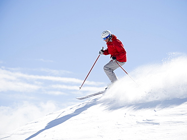 Man skiing downhill