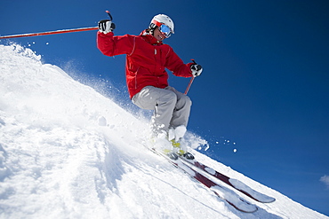 Man skiing downhill