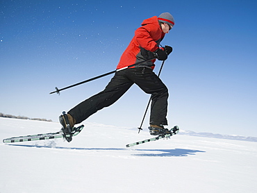 Man snow shoeing