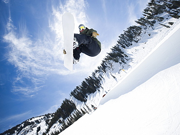 Man on snowboard in air