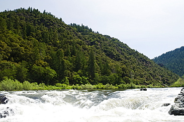 Whitewater raft approaching waterfall