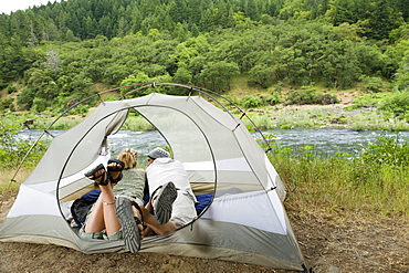 Couple relaxing in tent