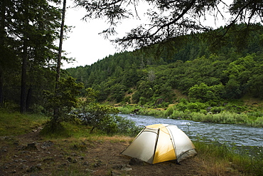 Tent and campsite by river