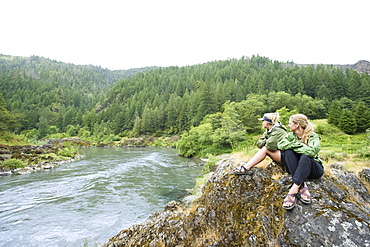 Hikers enjoying view of river