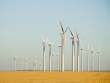 Rows of windmills on wind farm